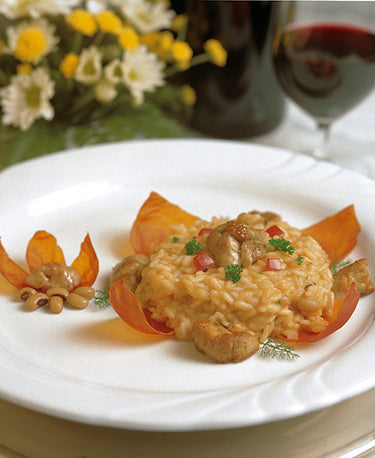 RISOTTO AUX HARICOTS BLANCS SERVI AVEC DU RIS DE VEAU SUR DES PÉTALES DE TOMATES 