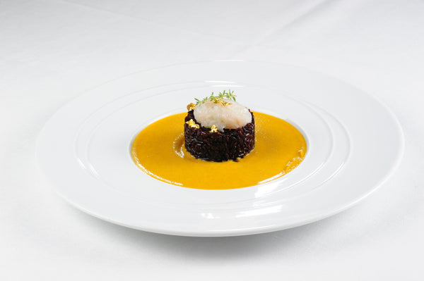Battuta di scampi su Riso Gallo Nero, crema di zucca e lenticchie