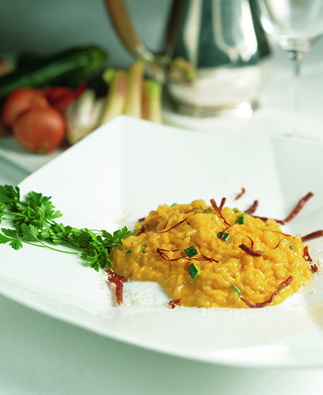 RISOTTO WITH COURGETTE FLOWERS, TRUMPET COURGETTES, FRESH ALMONDS AND PARMA HAM